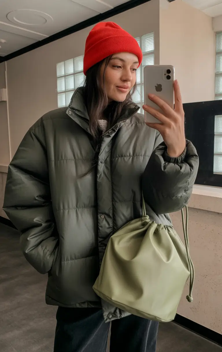 classy winter outfits ideas 2025-2026 Sporty Green Puffer with Bold Red Beanie