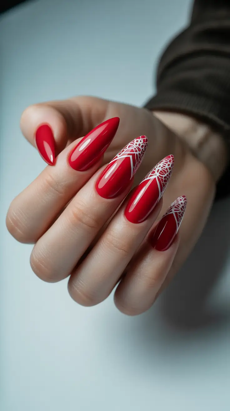 red winter nails ideas 2025 2026 Glossy Scarlet Almonds with Delicate Lace Detail