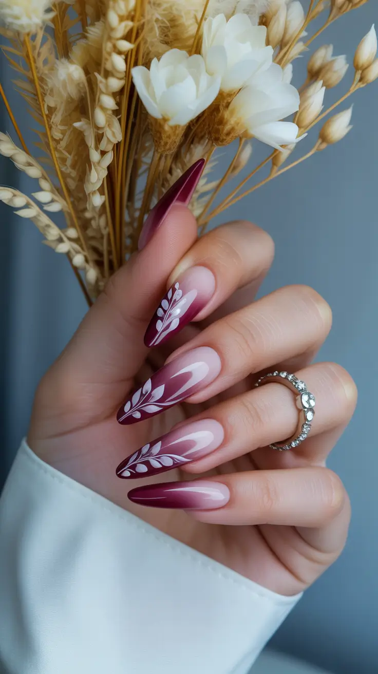red winter nails ideas 2025 2026 Wine Ombre with Leafy White Accents