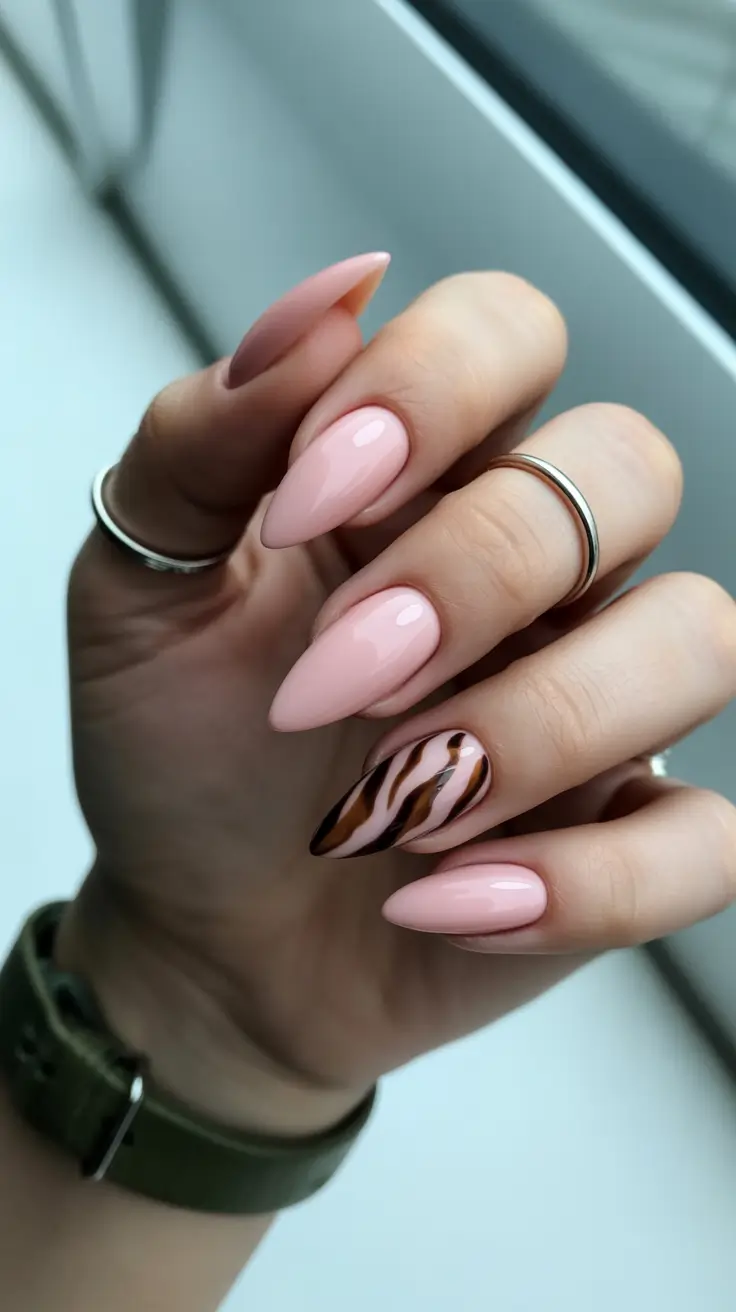 cute pastel nails 2026 Soft Pink Almond With Brown Zebra Accent