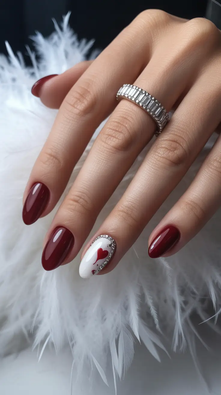 elegant short almond nails 2026 Romantic Burgundy With a Heart Accent and Crystal Halo