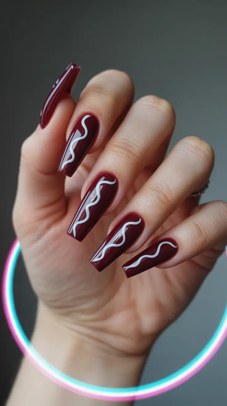 nail design trends 2026 Burgundy Graphic Lines