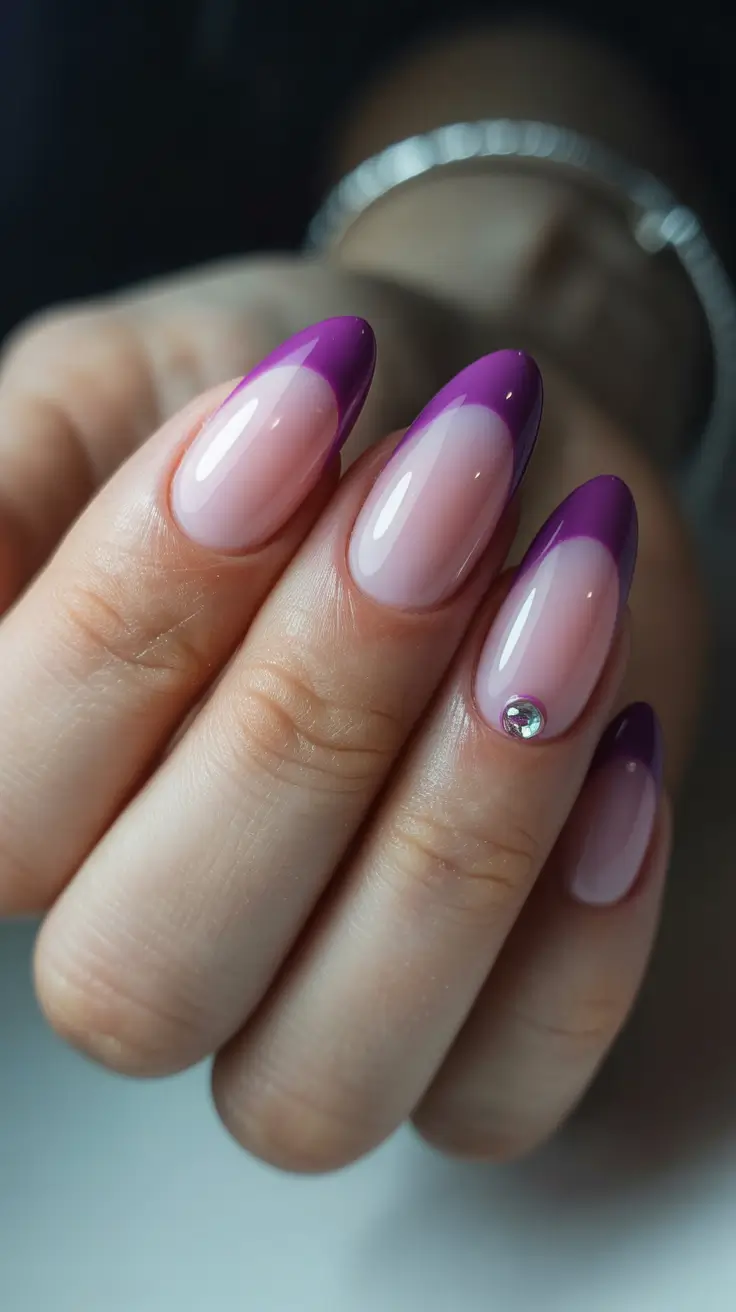stylish French nails 2026 Glossy Purple Almond French With a Crystal Accent
