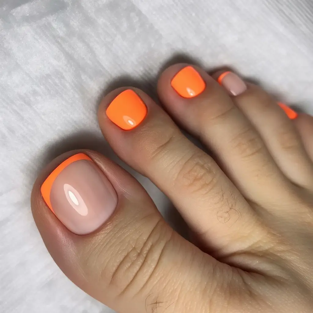 trending pedicure nails colors 2026 Neon Tangerine French Pop