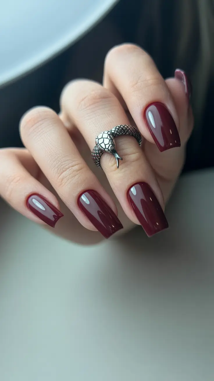 conservative spring nails for work 2026 Deep Merlot Gloss Structured Confidence
