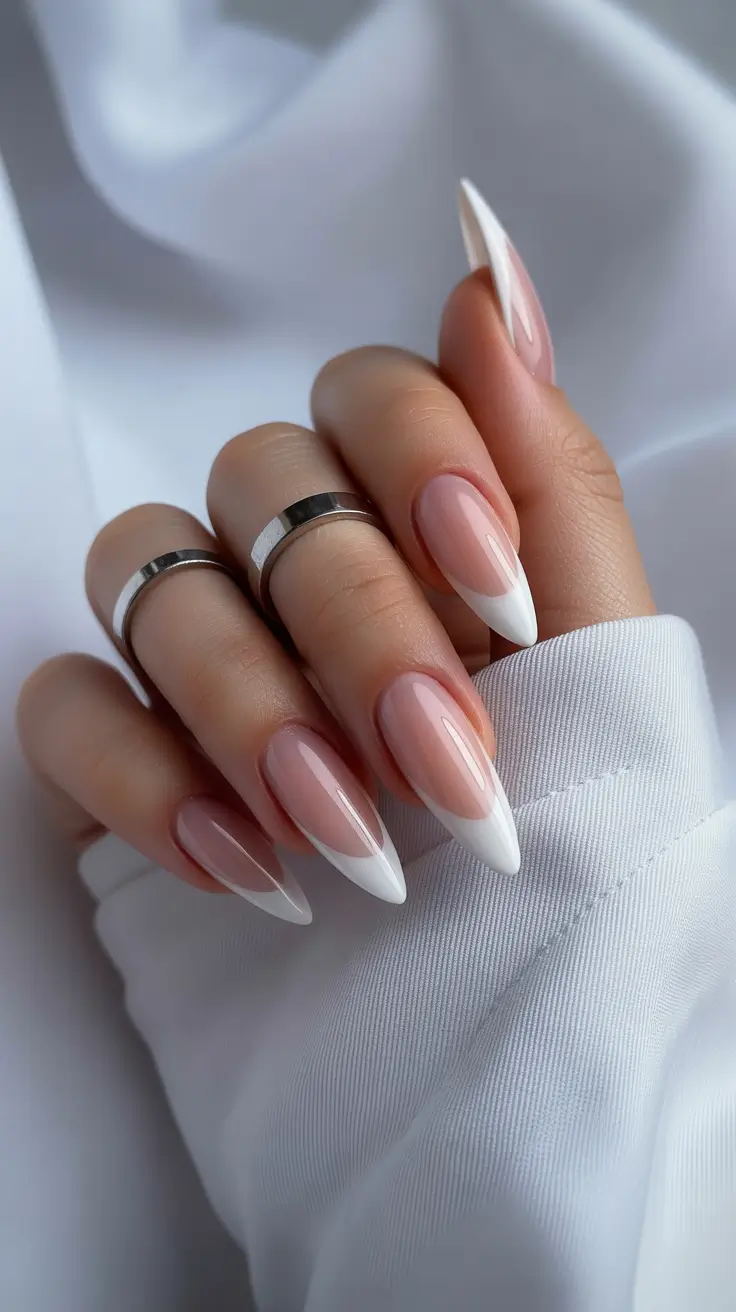 edgy spring almond nails 2026 Classic Almond French with a Modern Sculpted Edge