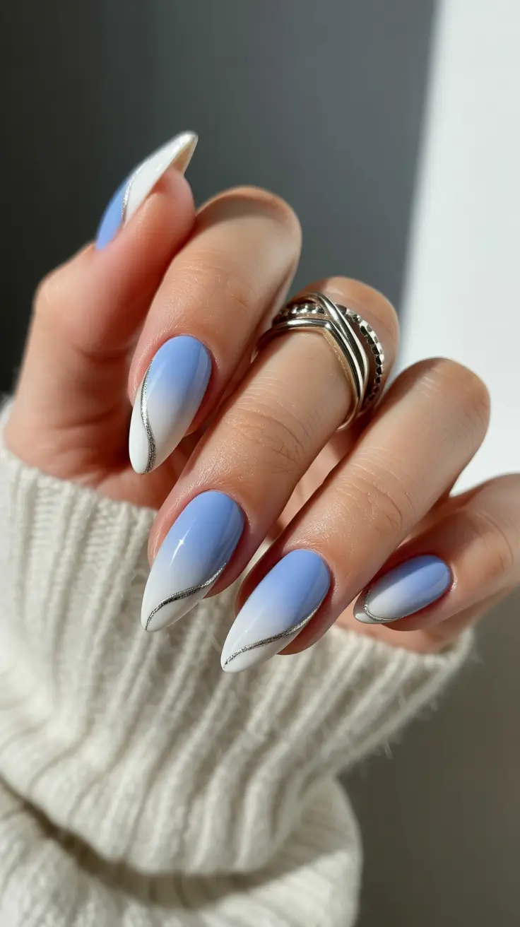edgy spring almond nails 2026 Pastel Blue Almond Nails with Elegant Silver Line Art