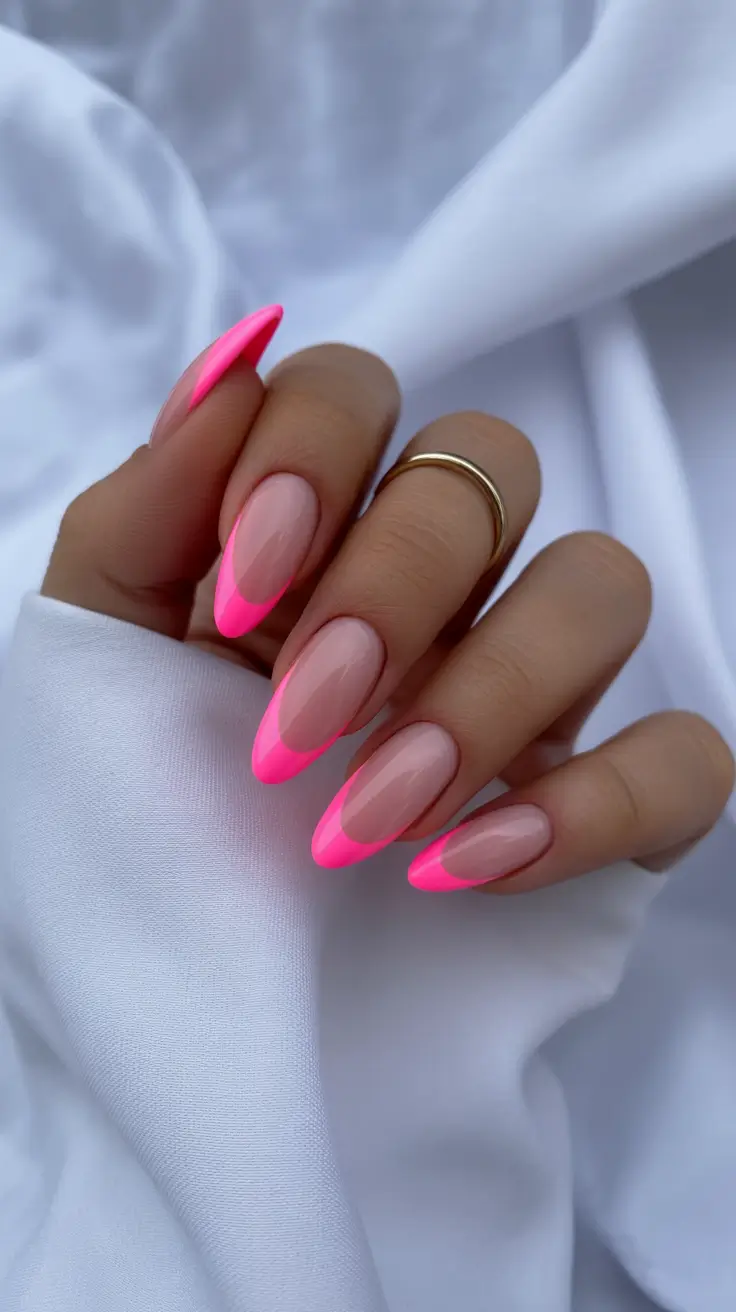 edgy spring almond nails 2026 Neon Pink French Almond Nails with a Modern Twist
