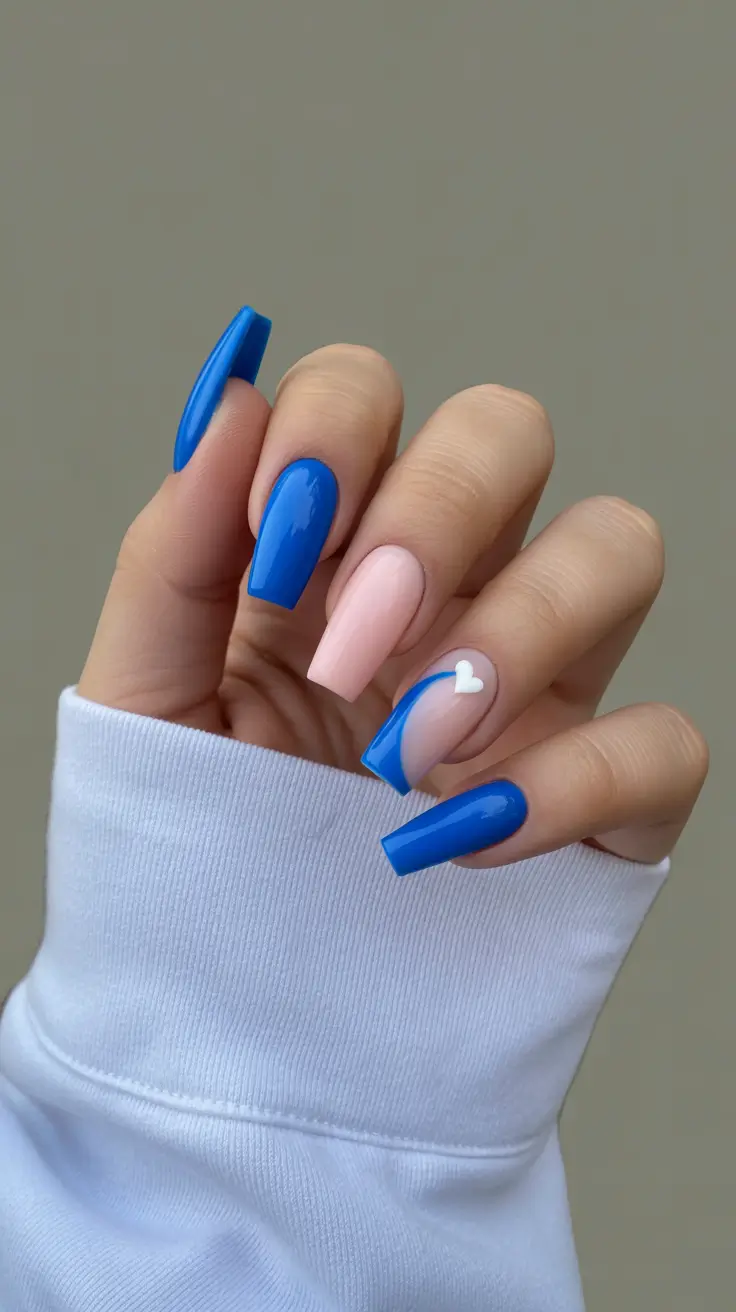 modern minimalist spring nails 2026 Bright Blue Graphic Mix With Soft Pink Accent