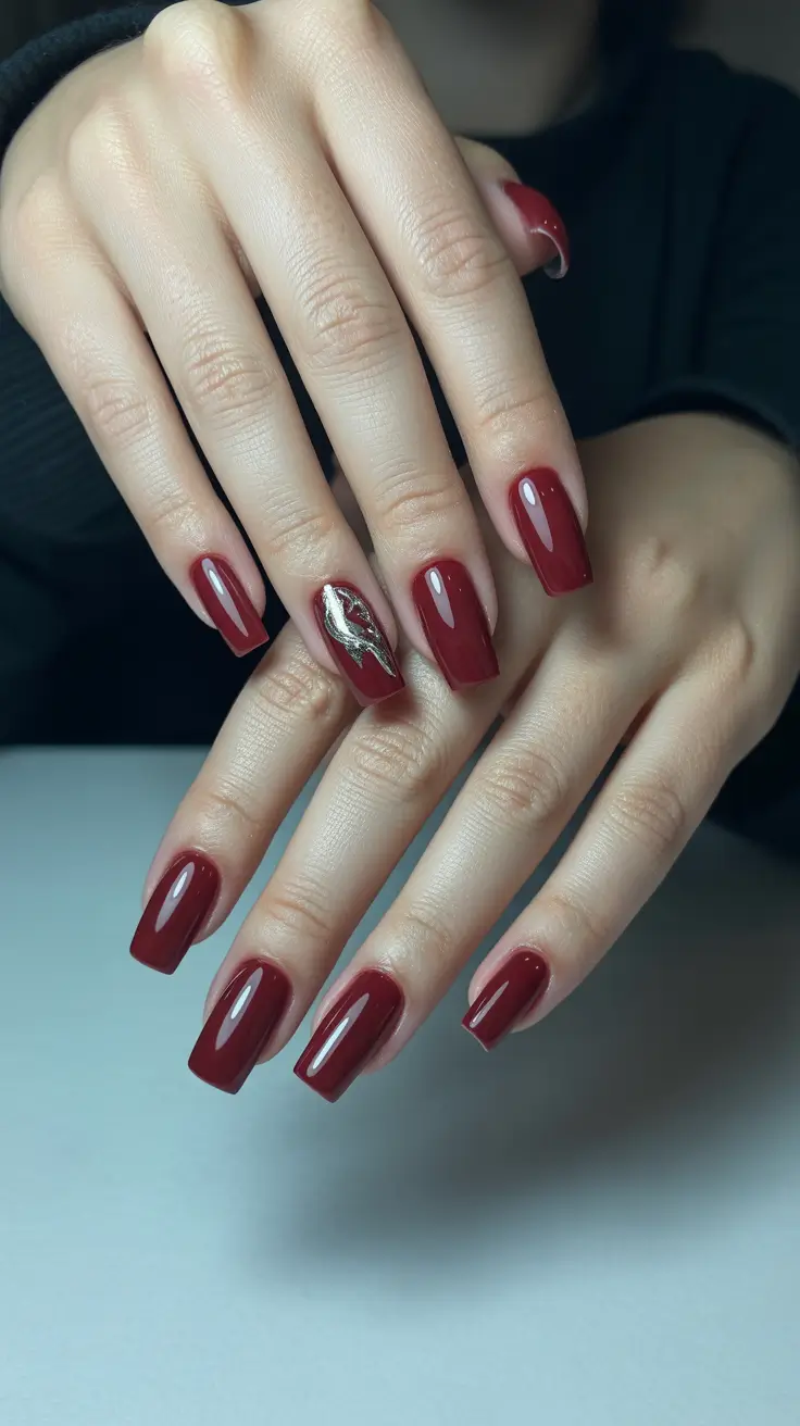 vintage spring gel nails fashion 2026 Deep Cherry Red Vintage Nails with Metallic Leaf Accent