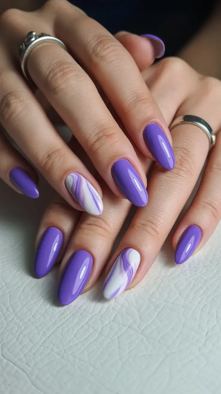 vintage spring gel nails fashion 2026 Glossy Violet Almond Nails with Marble Accent Design