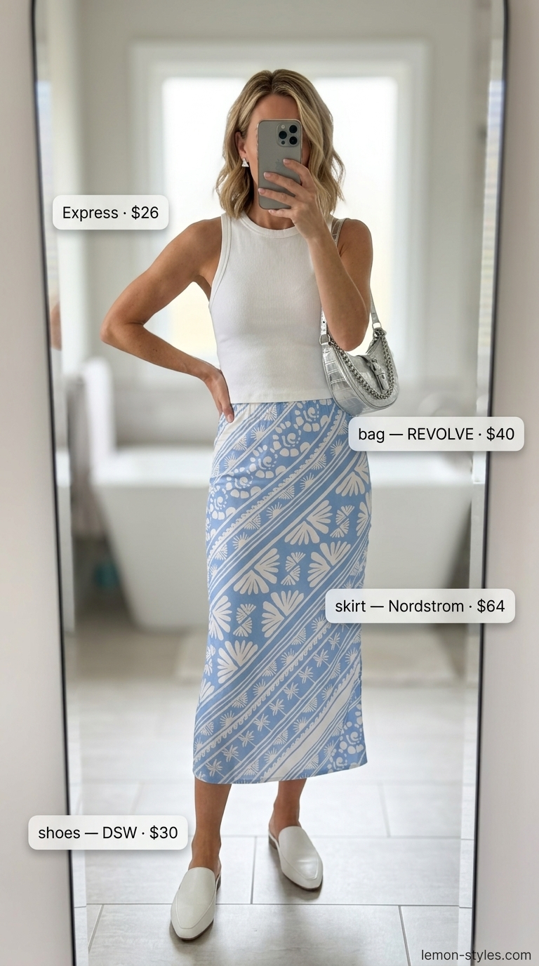 Bold summer fashion outfits for women 2026: Abstract print skirt, white tank, mules for artsy gallery style.