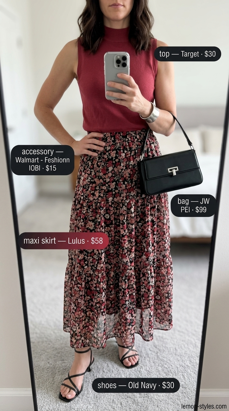 Sophisticated evening outfit: abstract floral maxi skirt, white mock neck top, black heels, and silver cuff. Summer 2026.