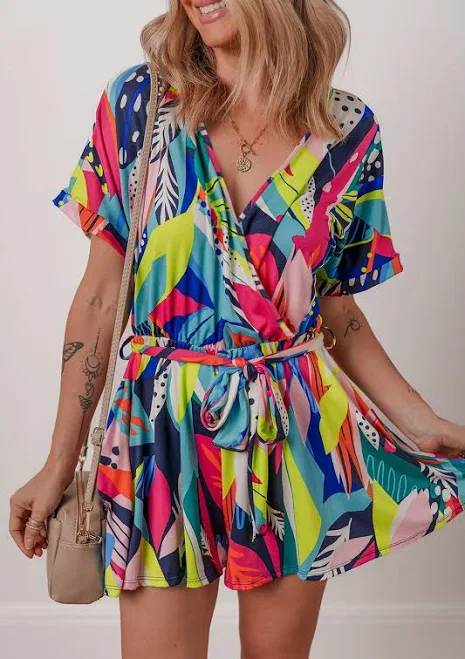 romper Sunny Angela Tropical Floral Print Surplice Neck Tie Waist Flared Romper eCrater - pulcherrimus $22.73