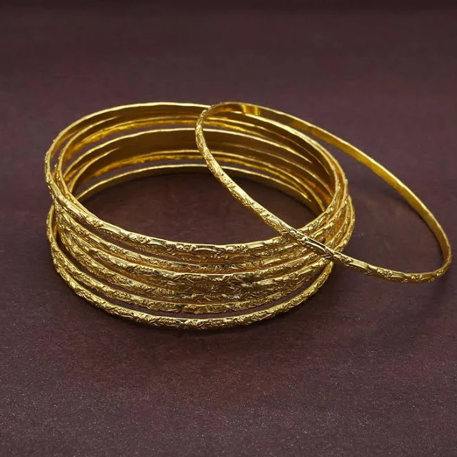 Statement gold hoop earrings with hammered texture