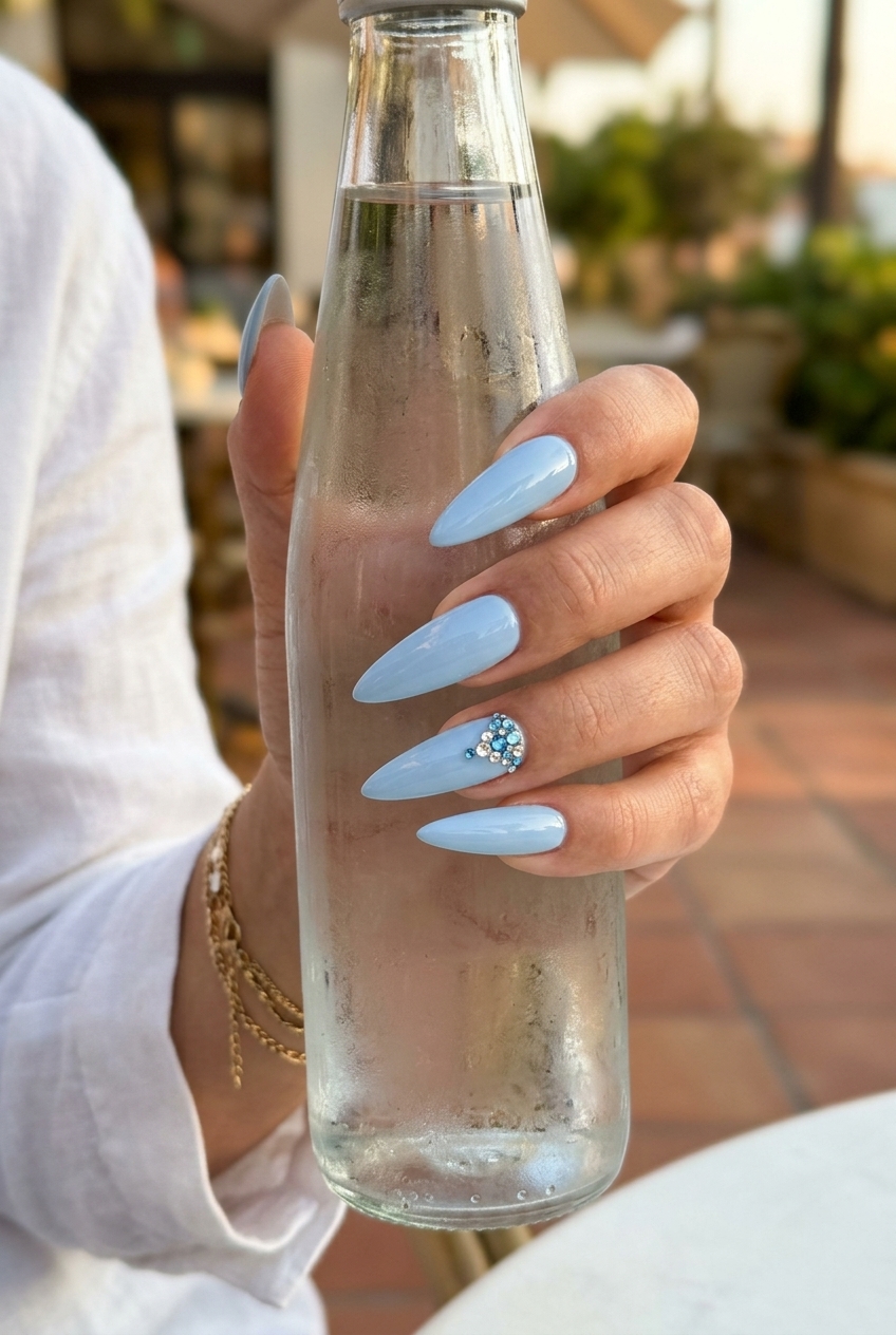 Sparkling Blue Stilettos 2026 | Glamorous Date Night Sparkling light blue stiletto nails with rhinestones for date night. Blue summer nails 2026.