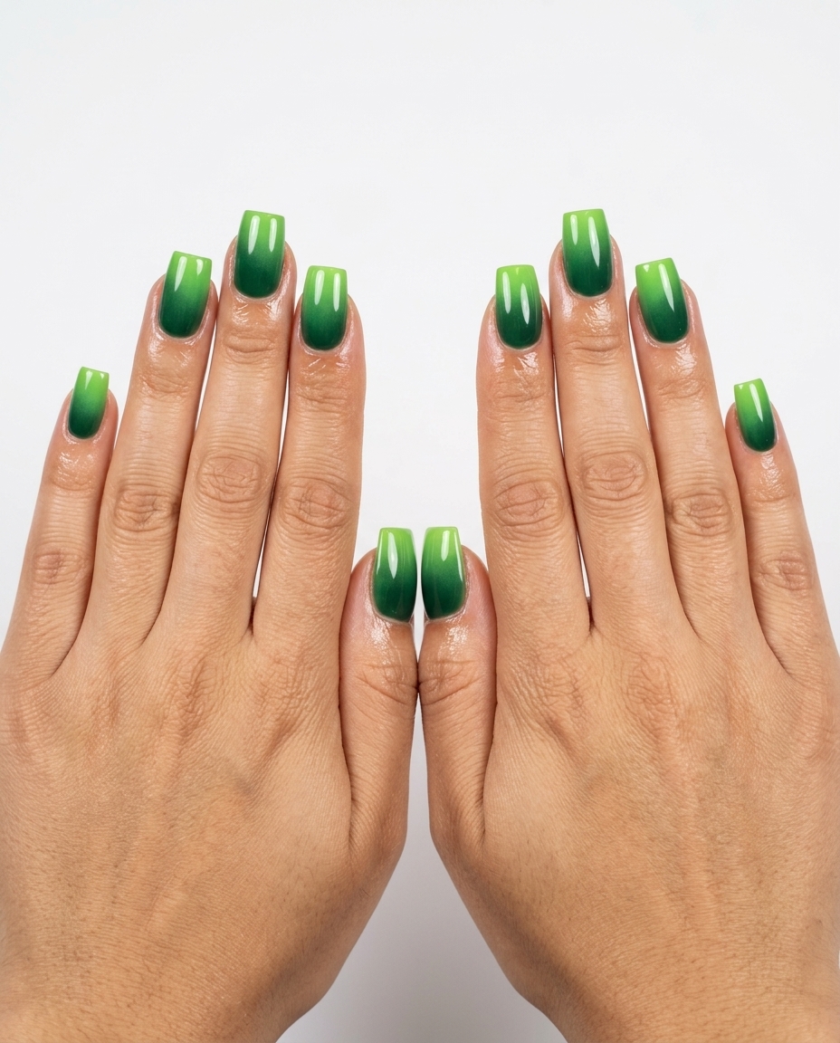 Airbrushed lime and deep green gradient nails for a summer vacation. Vibrant green summer nails 2026.