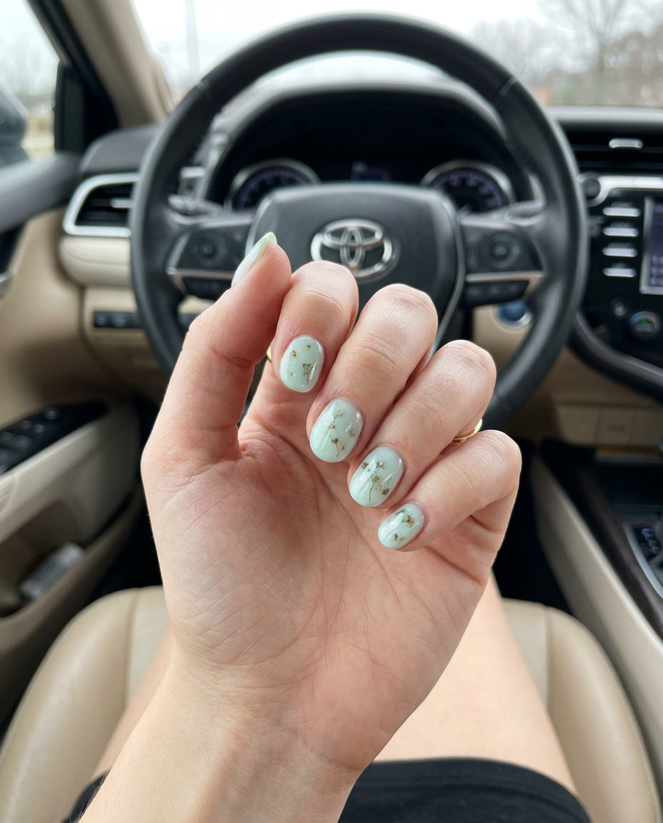 Mint green milk bath floral nails for weddings. Romantic green summer nails 2026 with delicate flowers.