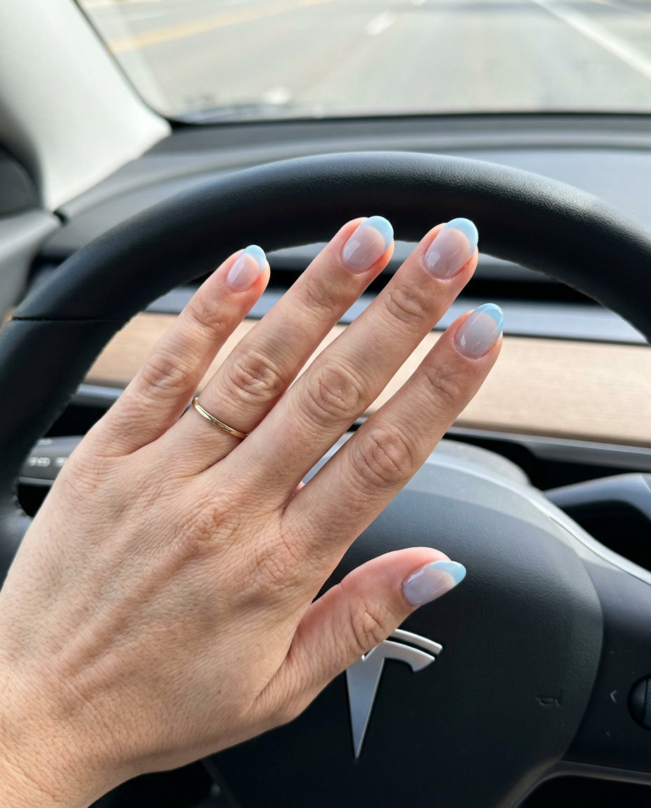 Sheer Sky French Nails 2026 | Romantic Summer Look Short round summer nails 2026: Ethereal sheer sky blue French tips for romantic occasions.