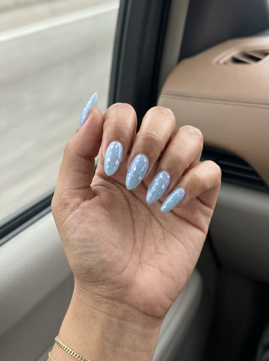 Celestial Chrome Almond Shimmer nails for a glamorous summer night out or festival outfit.