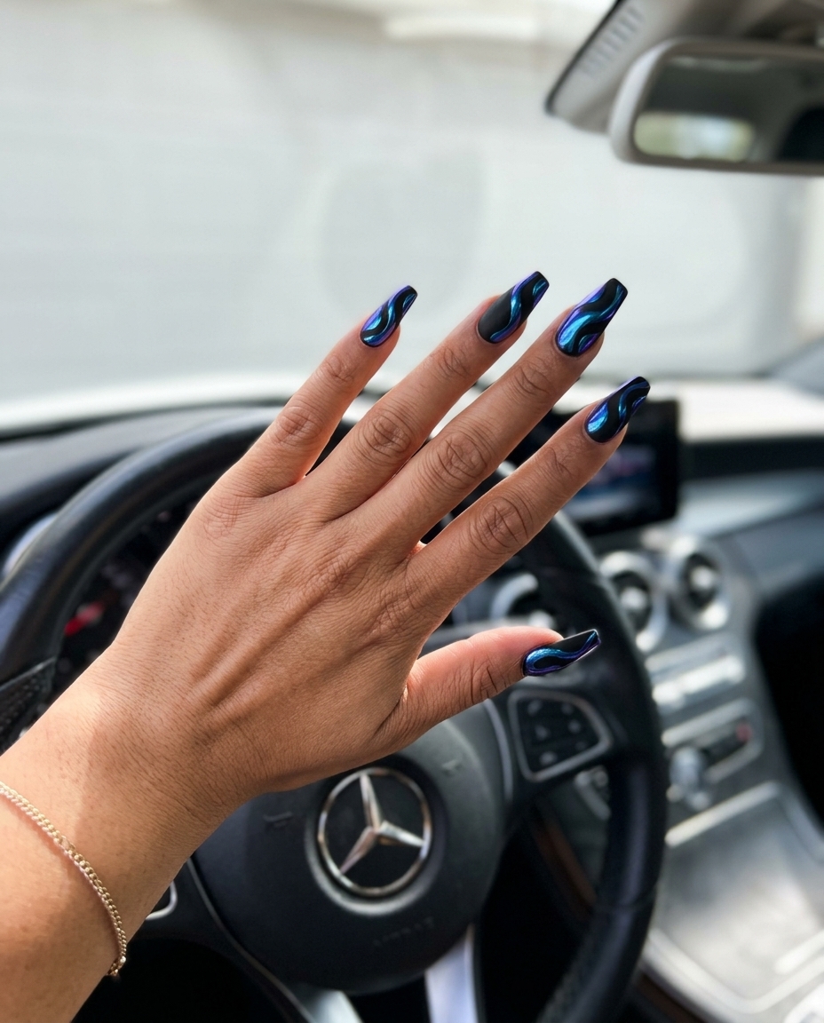 Chrome blue abstract swirls coffin nails for solid summer nails 2026. Futuristic edgy party look.