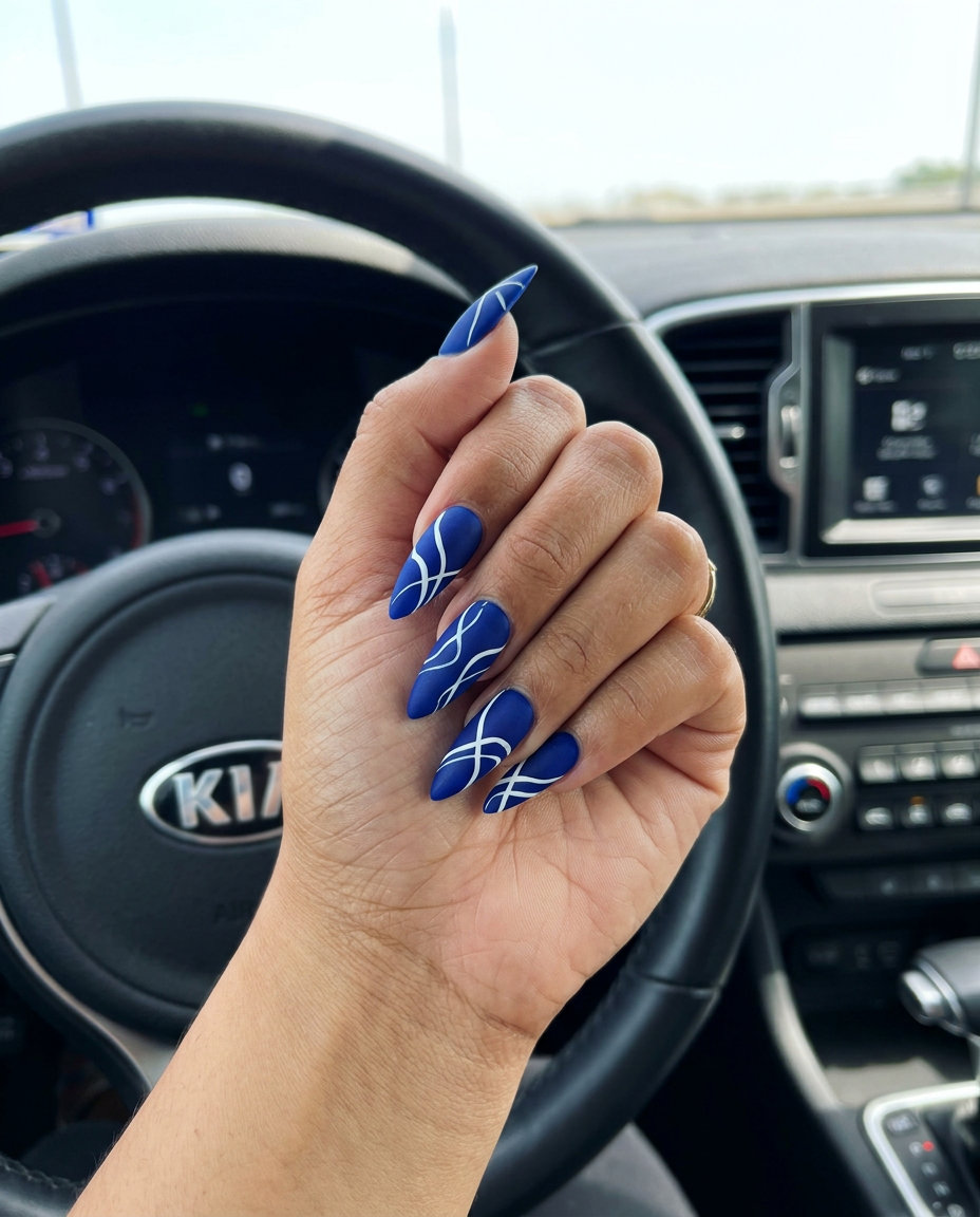 Artful Cobalt Abstract Line Stiletto Summer Nails 2026 Edgy cobalt blue abstract line stiletto summer nails 2026 for parties and art events.