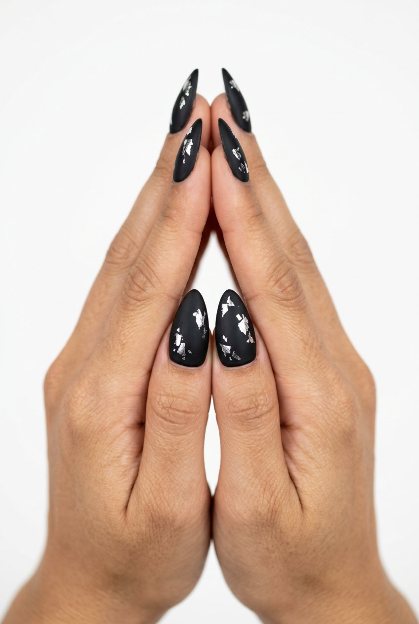 Edgy Matte Black Stiletto Summer Nails 2026 Edgy matte black stiletto summer nails 2026 with silver foil shards for nights out.