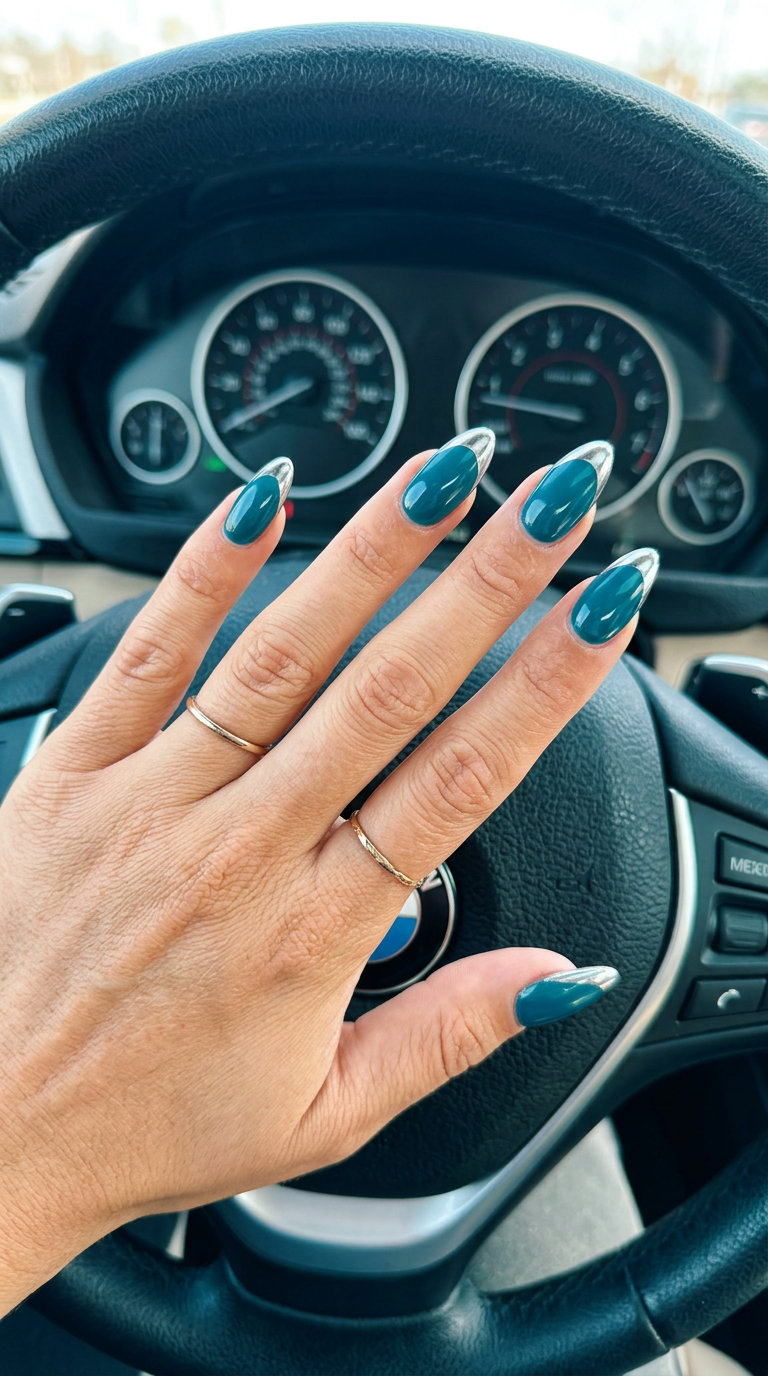 Deep Teal Chrome Tip Almond Nails 2026 Edgy deep teal chrome tip almond nails for summer almond nails 2026. Perfect for parties & date nights.