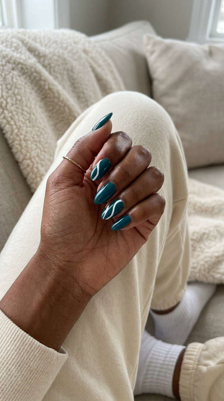 Teal Abstract Lines Almond Nails 2026 Teal abstract lines almond nails for summer almond nails 2026, edgy and artistic.