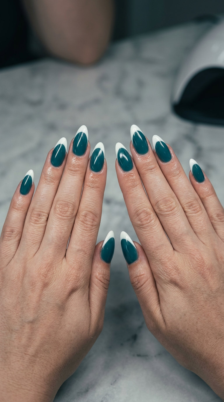 Deep Teal Milky French Nails 2026: Formal Glam Sophisticated deep teal milky almond French nails 2026 for formal events. Opaque white tips.
