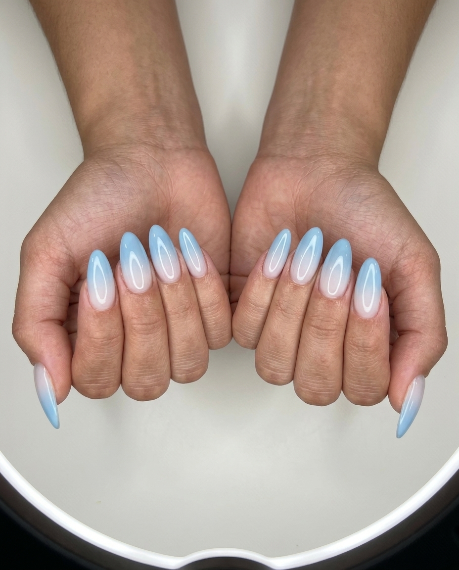 Sky blue jelly fade almond nails for summer classy nails 2026, ideal for vacation and casual daytime events.