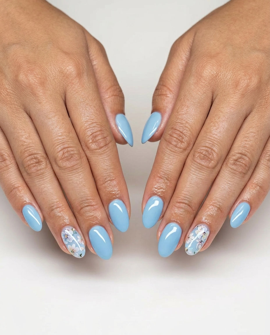 Sky Blue Floral Dip Nails 2026 Sky blue floral art accent dip nails for summer 2026. Romantic vacation and casual weekend style.