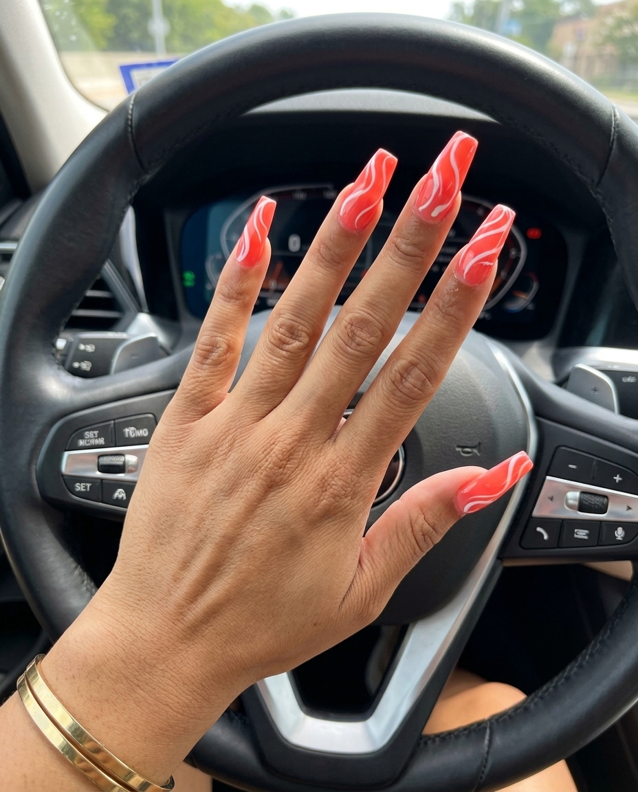 Vivid Coral Abstract Swirl Dip Nails 2026 Vivid coral abstract swirl extra-long coffin dip nails for summer 2026, edgy for parties.
