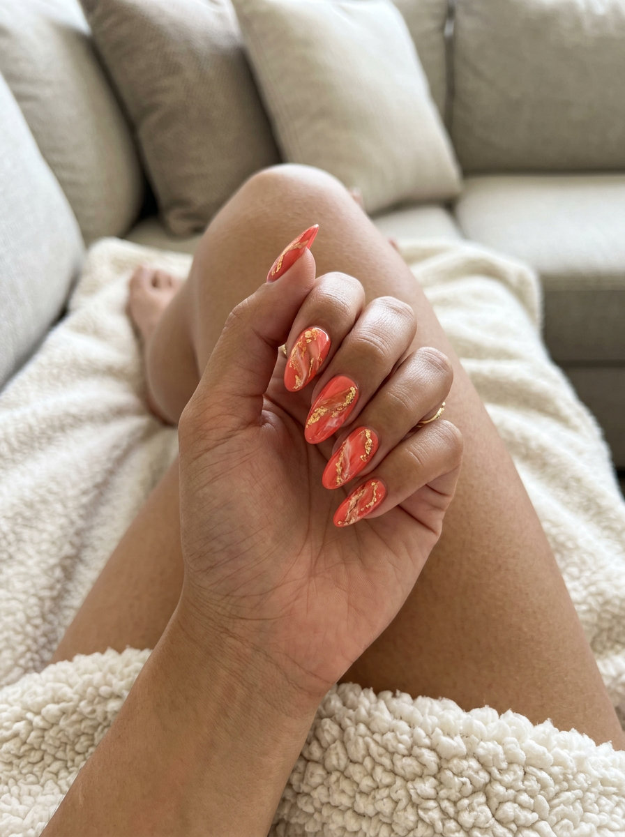 Summer Holiday Nails 2026: Coral & Gold Marble Coral & Gold Sunburst Marble nails for summer holiday nails 2026: glamorous date night or summer party look.
