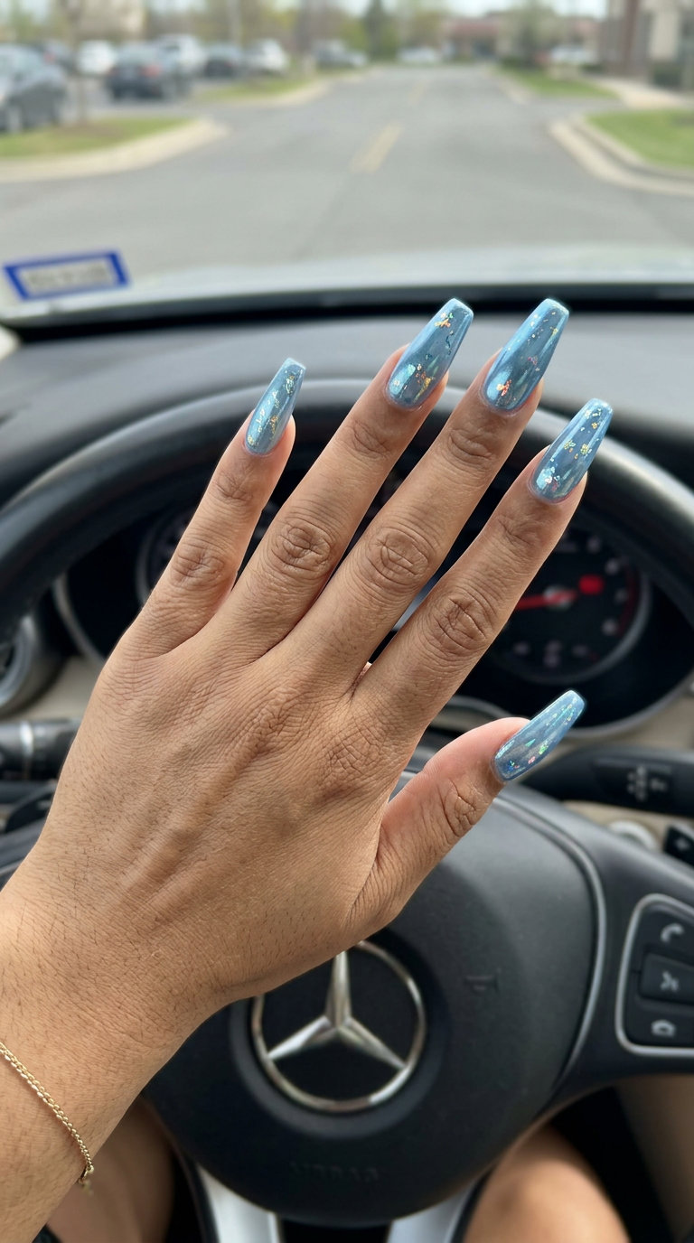 Icy Blue Shimmer Stiletto Nails 2026: Cool Glam Futuristic icy blue shimmer stiletto nails for summer holiday nails 2026. Perfect for parties.