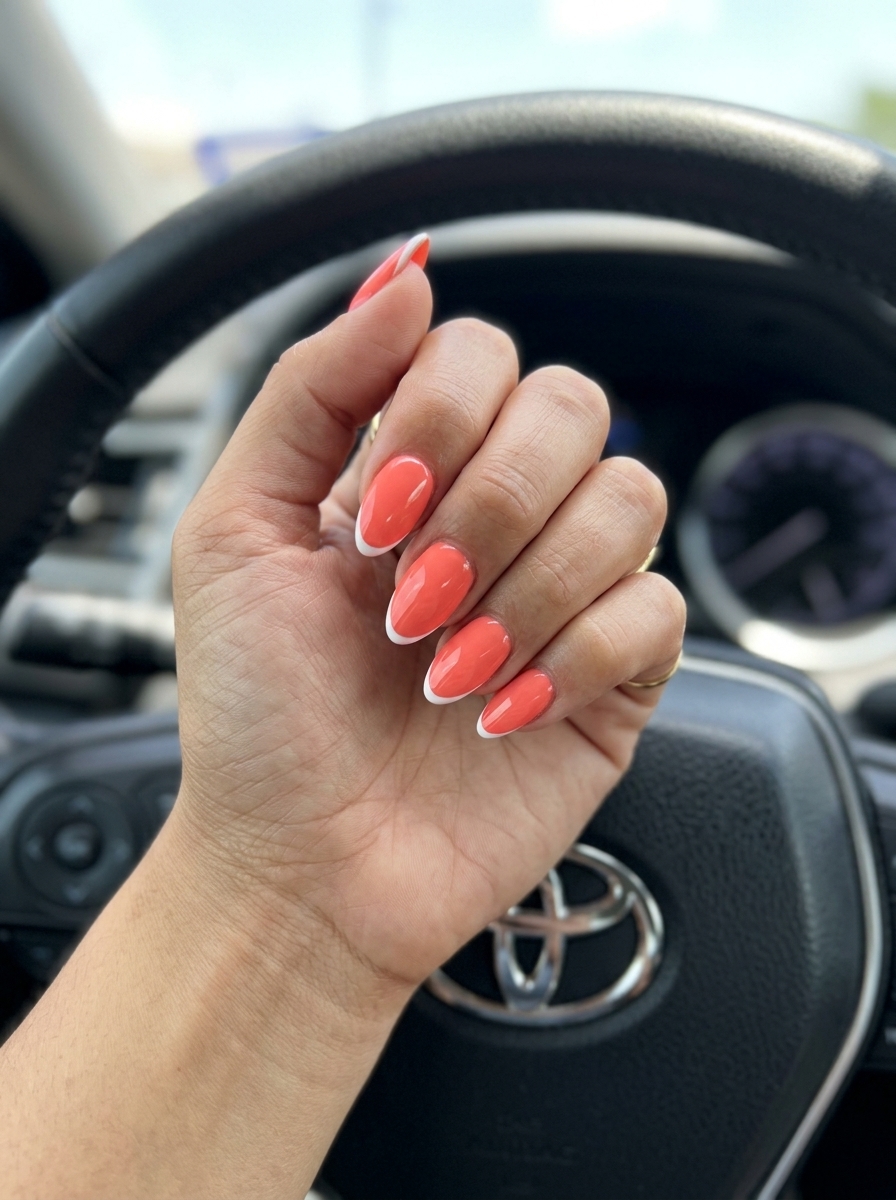 Vibrant coral glossy square nails for summer nail manicure ideas 2026. Playful vacation style.