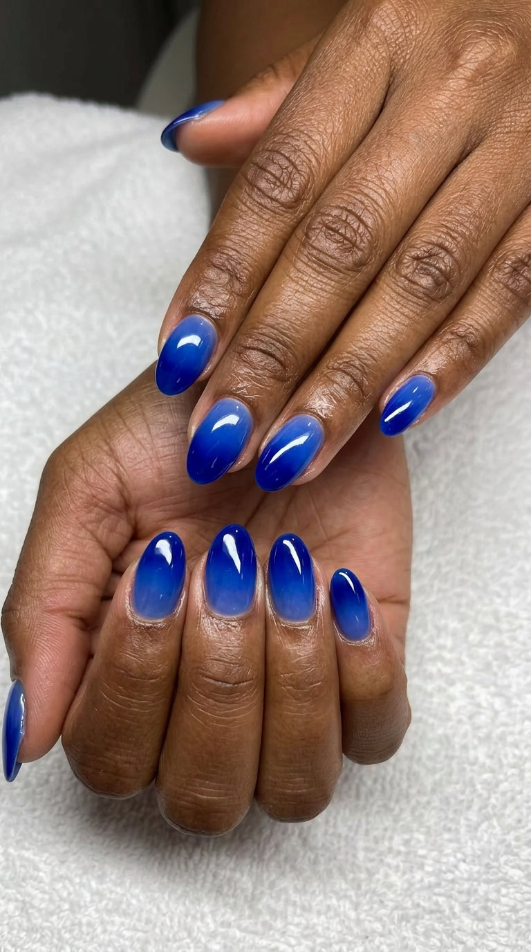 Sapphire Jelly Ombre Nails 2026 Vibrant sapphire blue jelly ombre gradient nails for summer nails for dark skin 2026. Luxe vacation vibes.