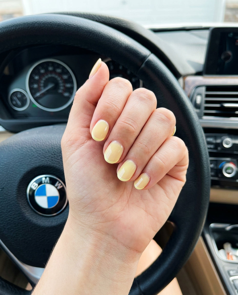 Elegant pastel yellow reverse French oval nails for work and bridal showers. Summer nails yellow 2026.