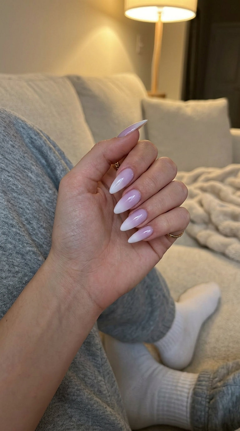 Milky Lilac to White Stiletto Ombre Nails 2026 Milky lilac to white stiletto ombre nails for summer ombre nails 2026 party looks. Glamorous gel polish.