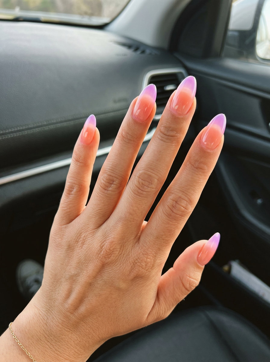 Summer Ombre Nails 2026: Jelly Peach Lilac Almond Jelly peach and lilac ombre almond nails for summer ombre nails 2026. Playful festival style.