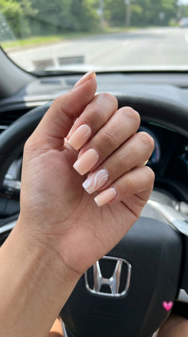 Summer Peach Nails 2026: Milky Swirl Accent Chic summer peach nails 2026 with a pale peach milky base and delicate pearlescent white swirls on accent nails.