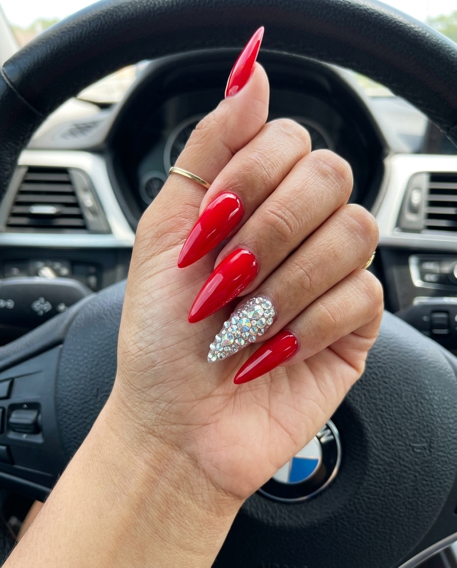 Rhinestone Red Stiletto Nails 2026 Bold true red stiletto nails with rhinestones for summer red nails 2026 festival outfits.