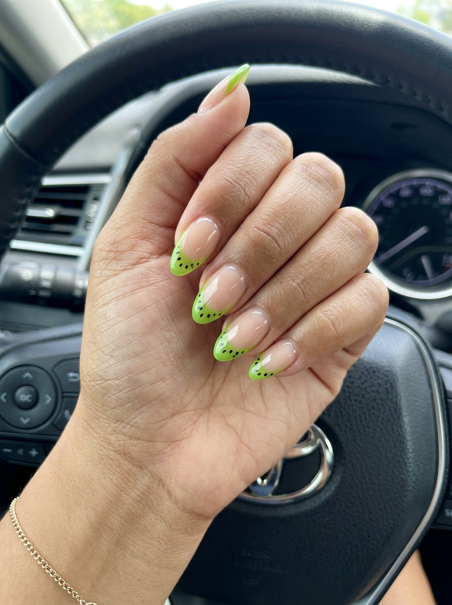 Lime green kiwi slice French nails 2026: Whimsical, fresh gel art for casual weekends and brunch. Jelly tips with seed dots.
