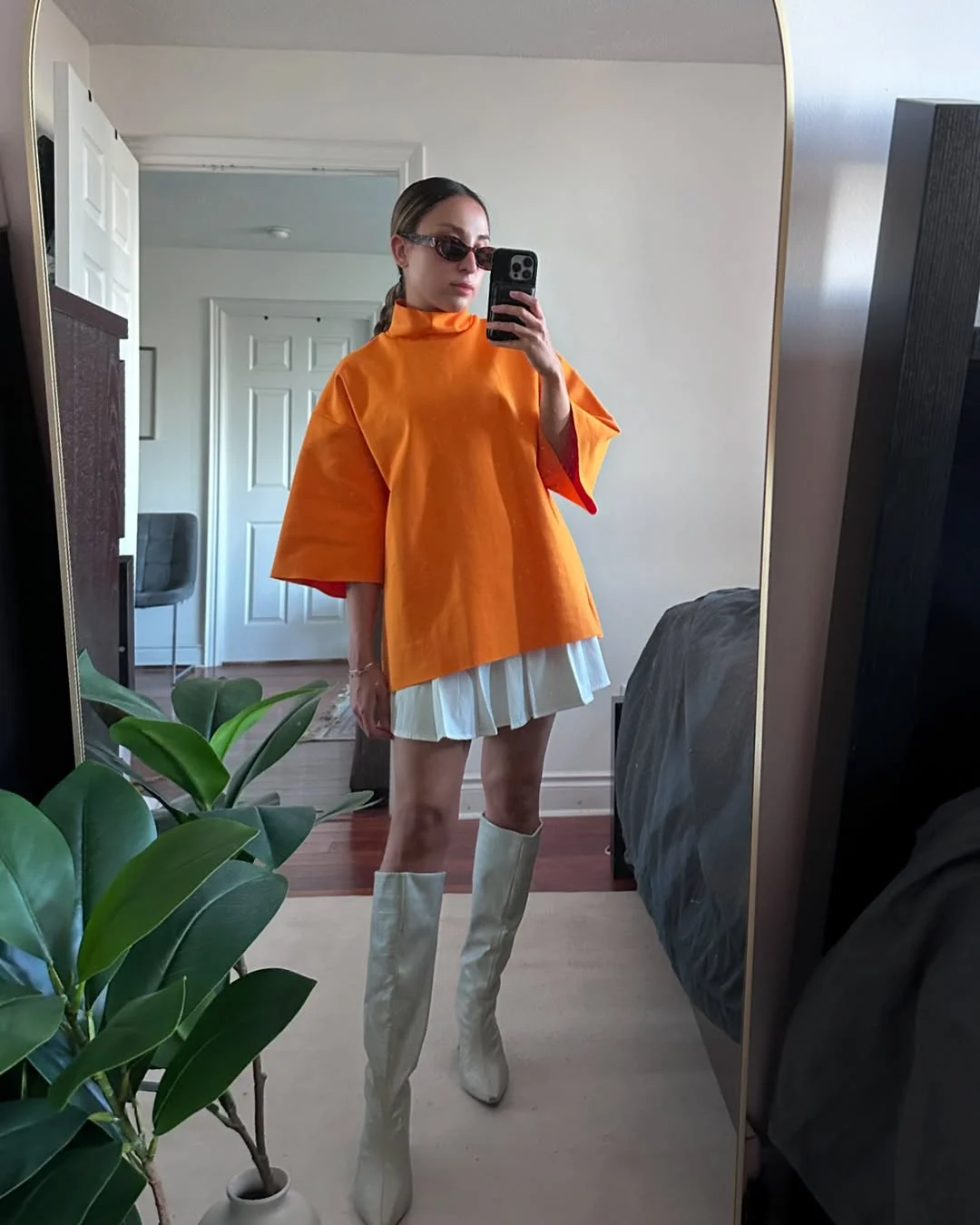 Early fall outfits ideas 2026 Bright Tangerine Layers With Tall Boots