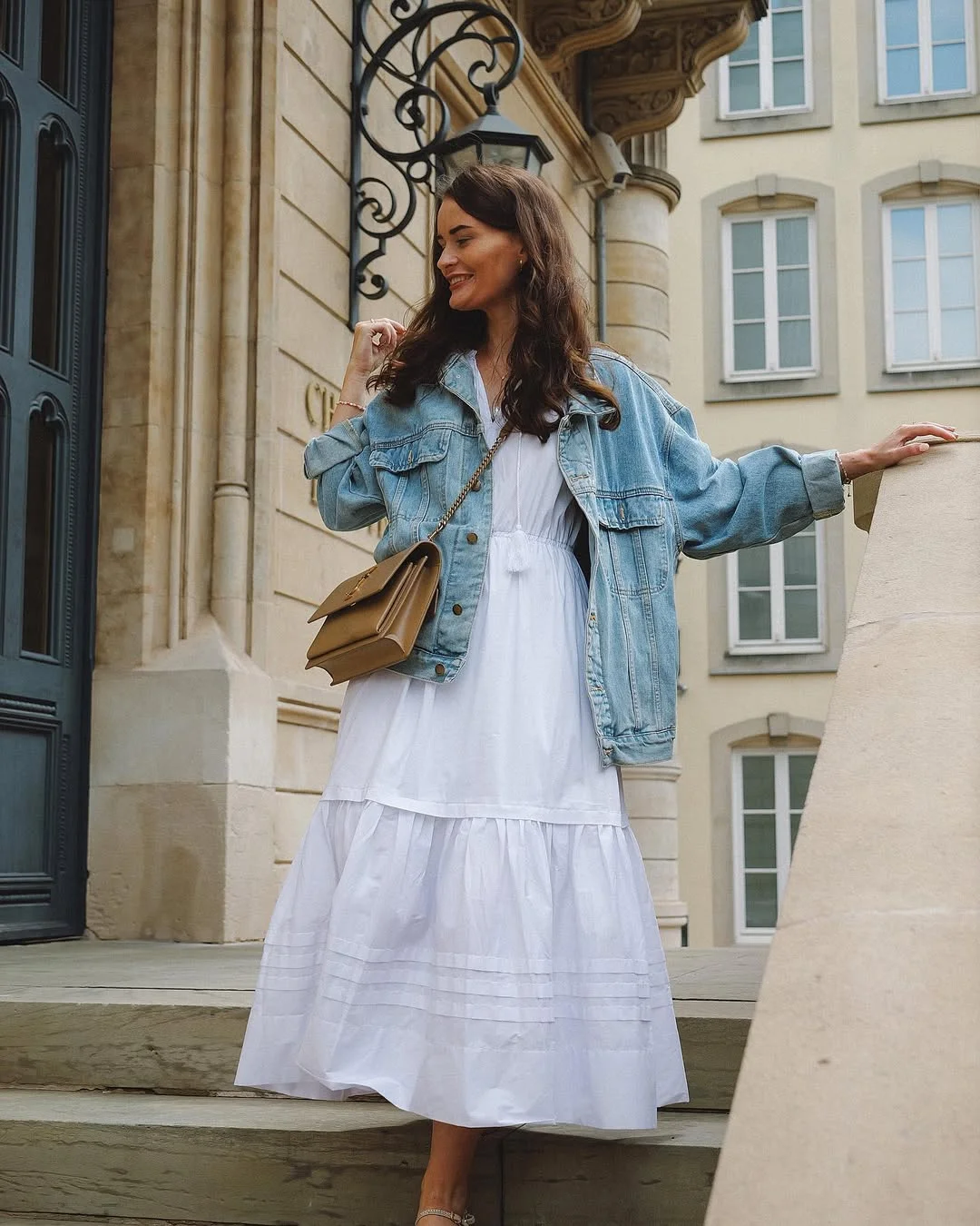 fall outfits with jeans jacket 2026 A Soft White Dress Styled with an Oversized Denim Jacket