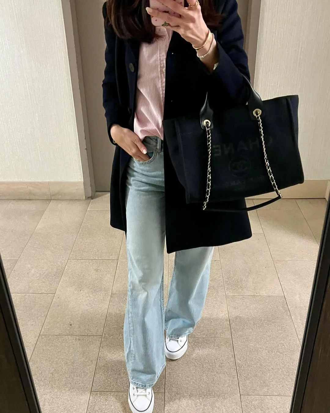 fall outfits with sneakers and jeans 2026 Tailored Navy Coat with Light Denim and Classic Sneakers