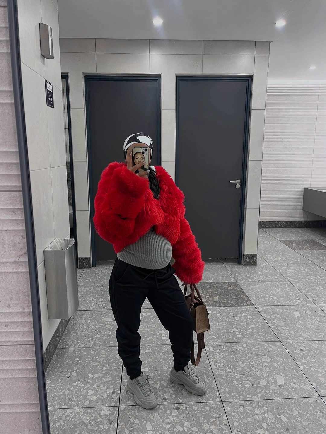 fall pregnancy outfits 2026 A Bold Pop of Red Makes Cold Days Feel More Fun