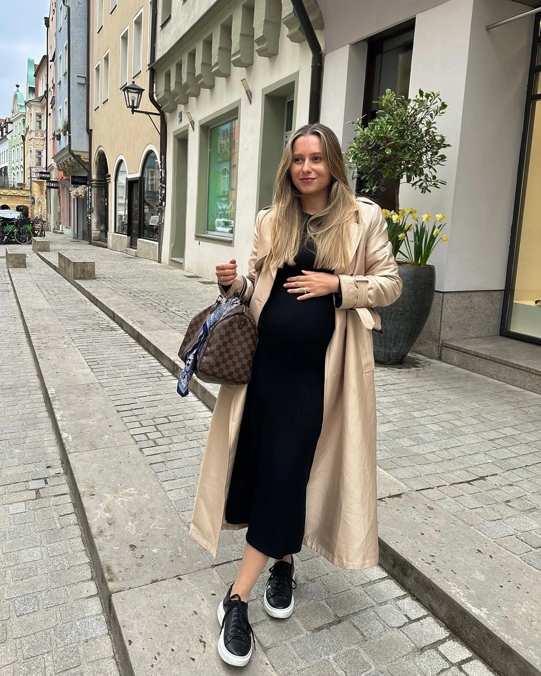 fall pregnancy outfits 2026 A Black Knit Dress and Trench Coat Never Fail
