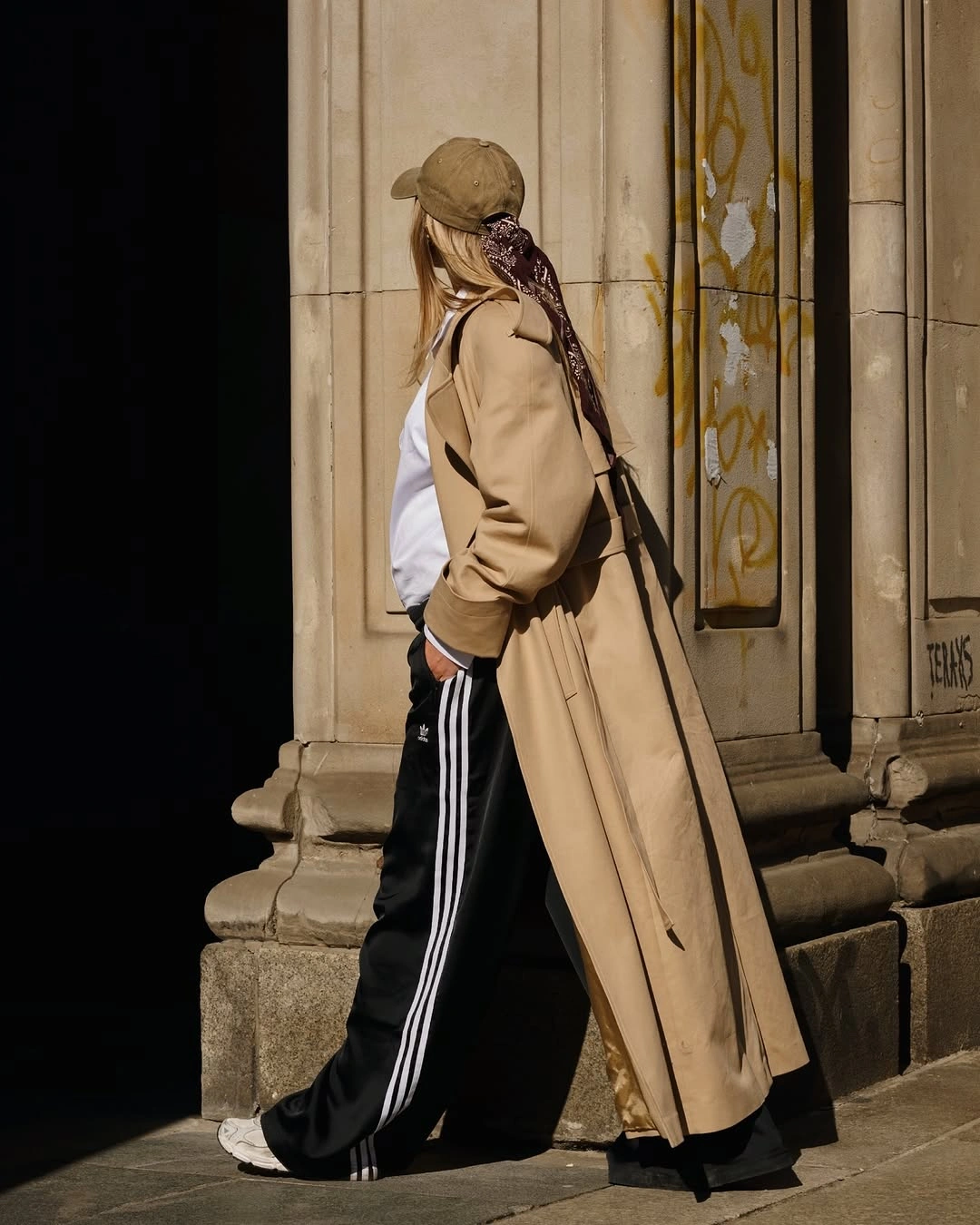 fall pregnancy outfits 2026 A Trench Coat and Sporty Pants Make Casual Style Feel Current