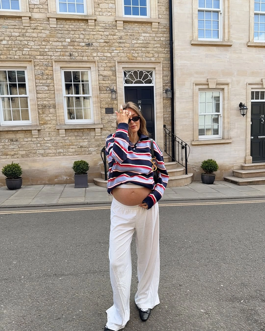 fall pregnancy outfits 2026 Striped Knitwear and White Pants Create a Fresh Fall Balance